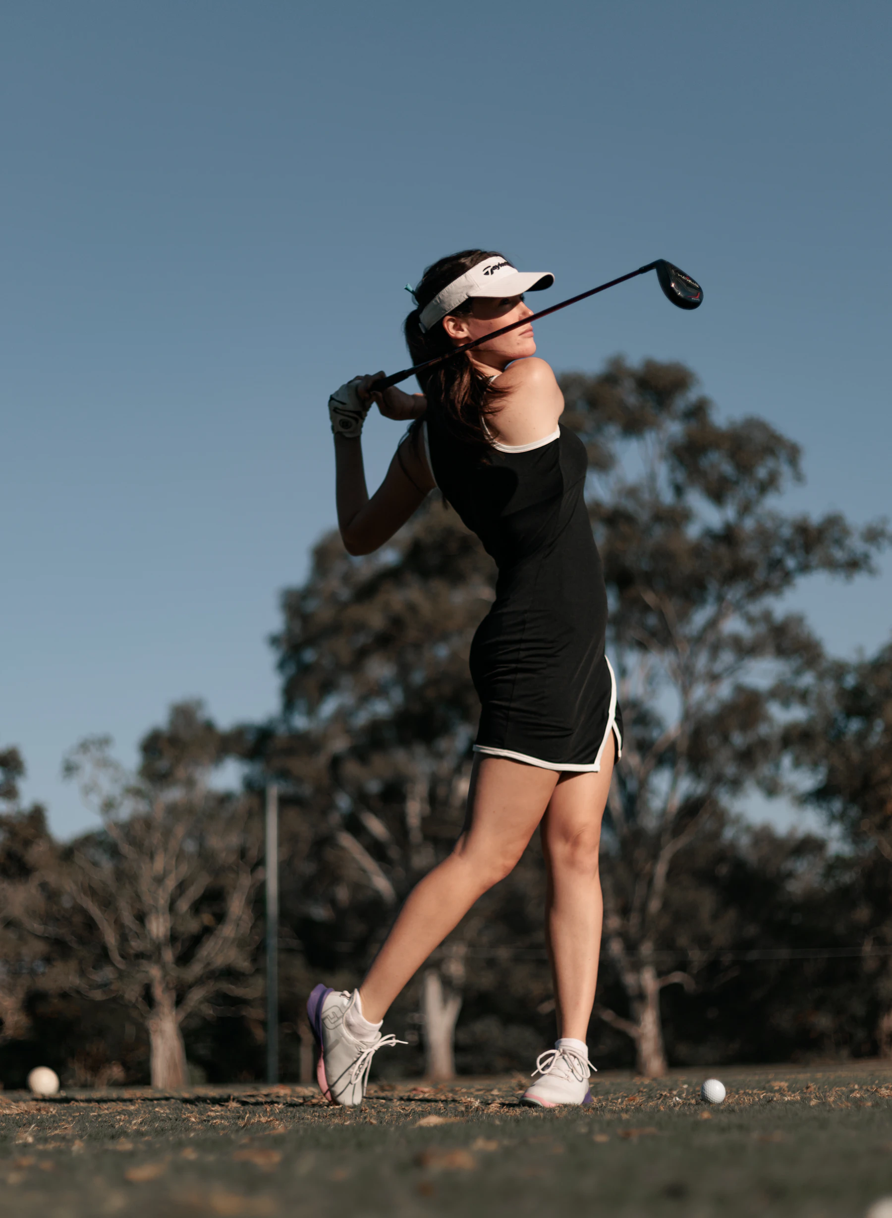Golfer holding the finish after a drive